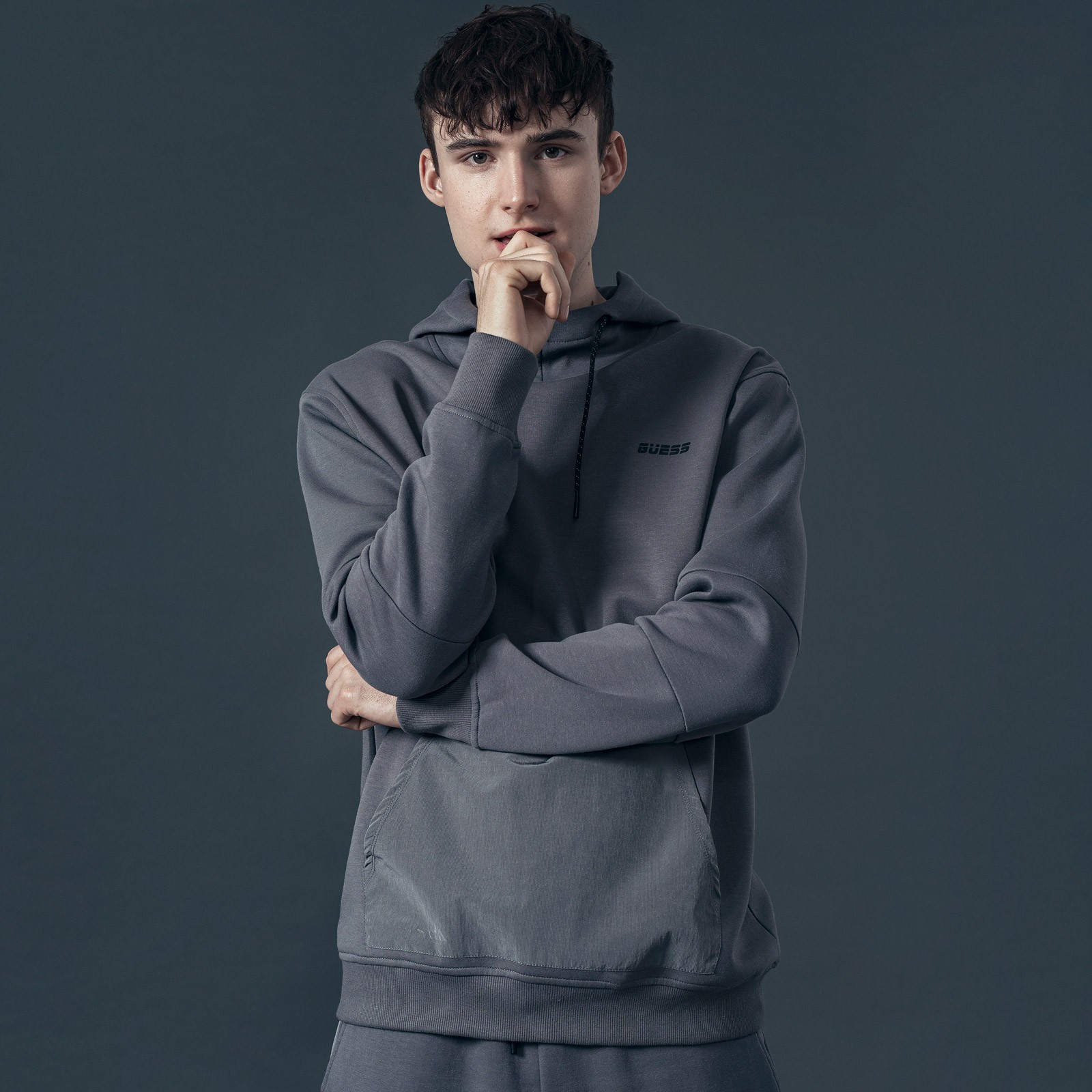 Graphic depicting a hexagonal cropped photo of an interior room design with grid lines along its borders.