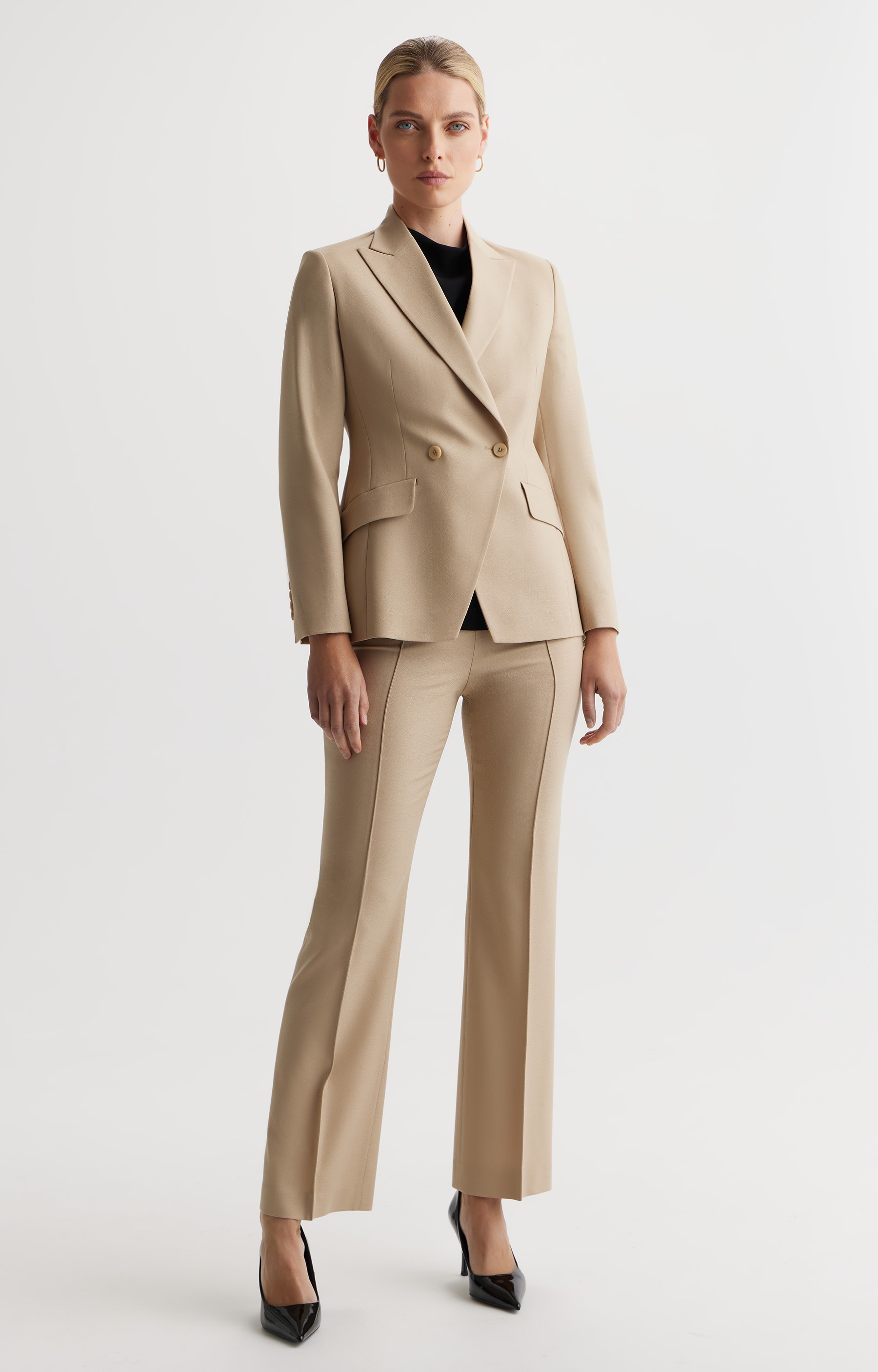 Graphic depicting a hexagonal cropped photo of an interior room design with grid lines along its borders.