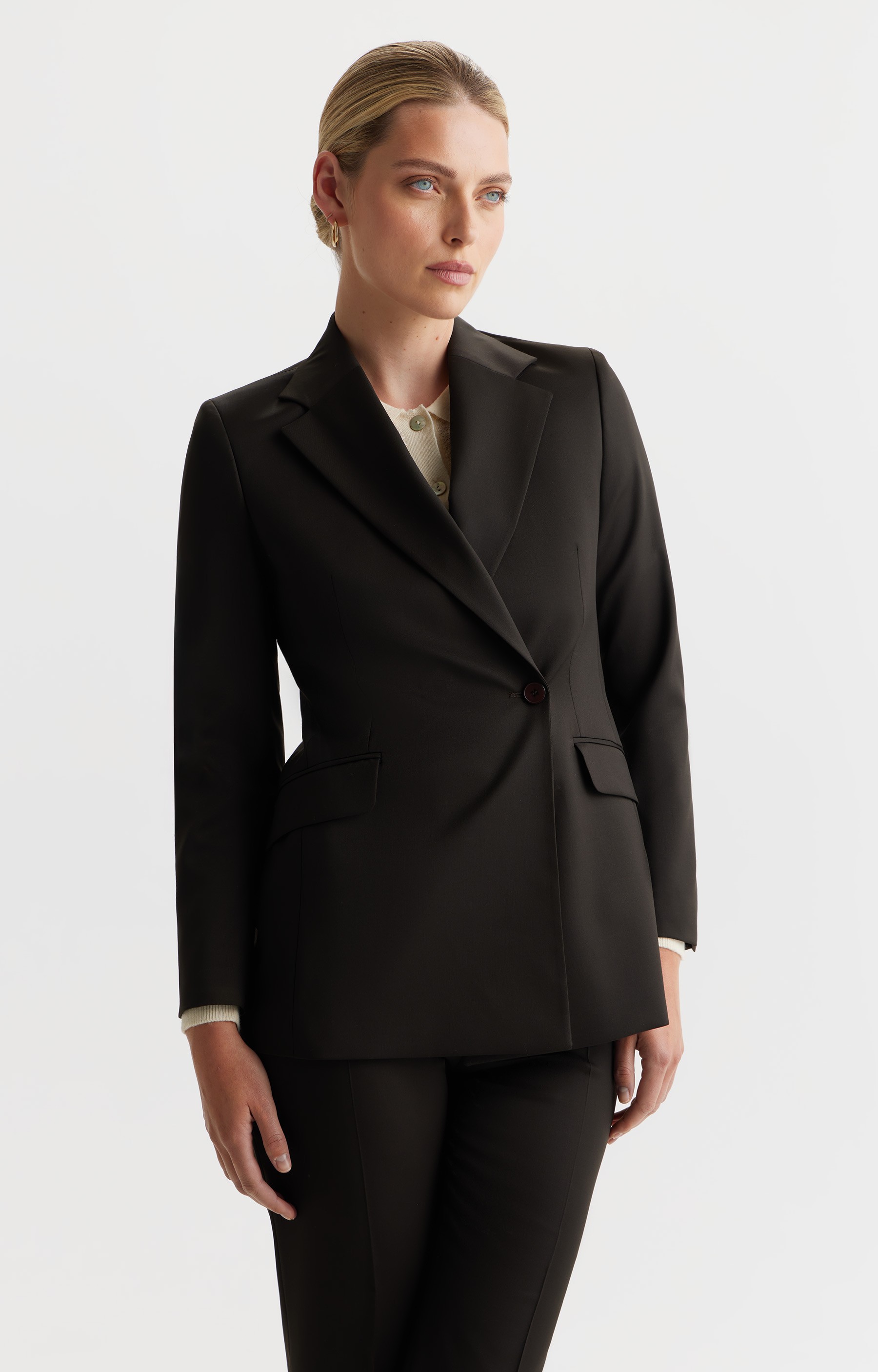 Graphic of a typography specimen showing the alphabet and numerals on top of a dark gray background.