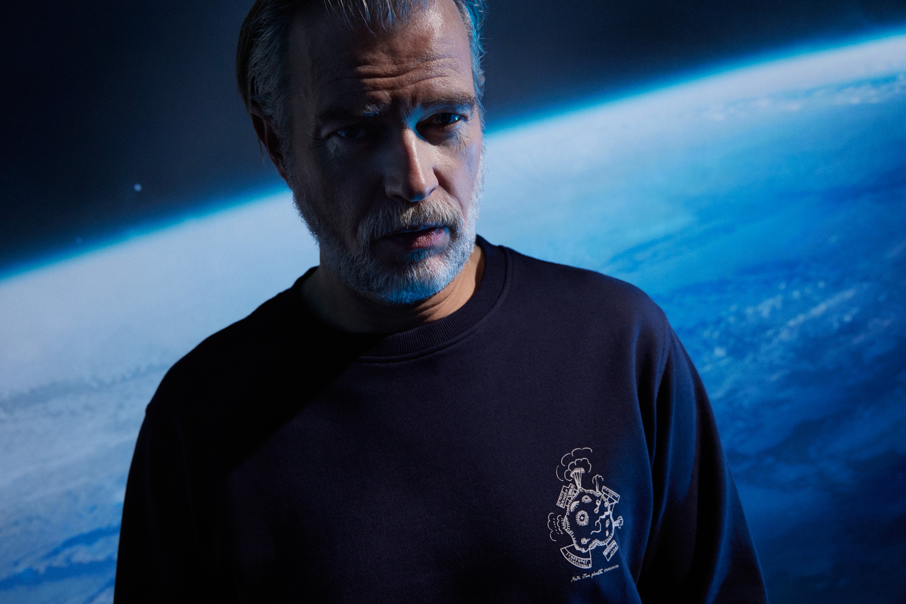 Graphic depicting a hexagonal cropped photo of an interior room design with grid lines along its borders.